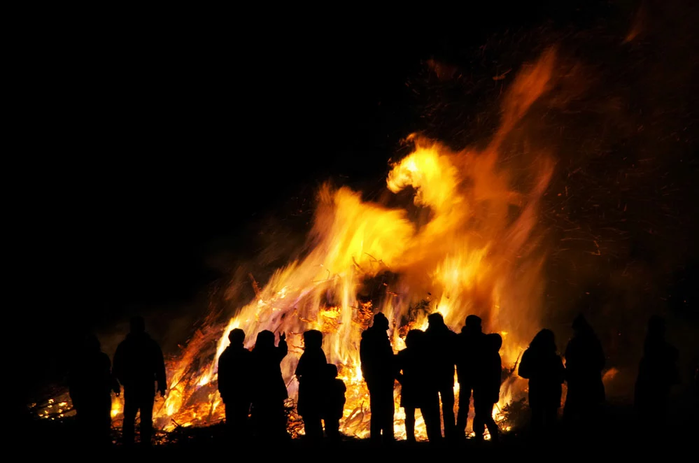 Campfire vs. Bonfire -People in a bonfire