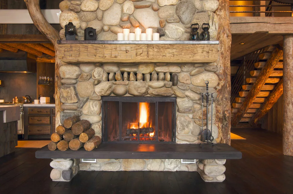 A rustic Fireplace in Log Cabin. 