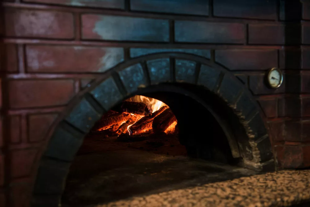 A brick oven with fire. 