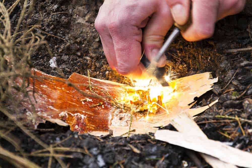 Starting a fire with a Ferro rod. 