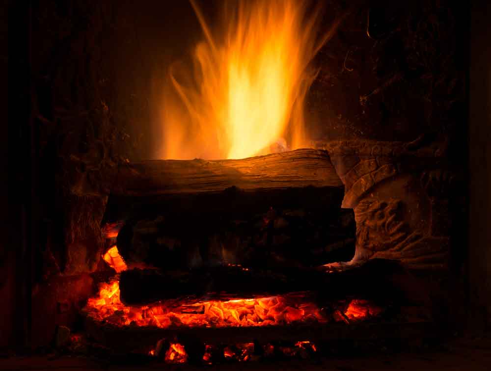 Firewood burning in a fireplace