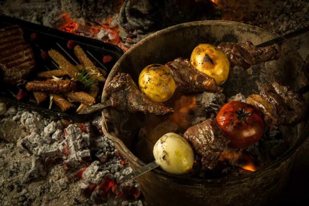 Food cooking on hot coals