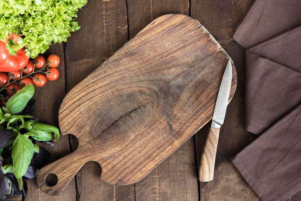 wood cutting board with a knife