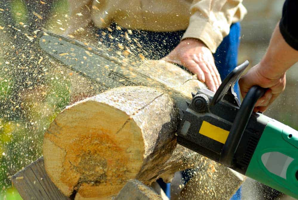 A man working with a lumberjack